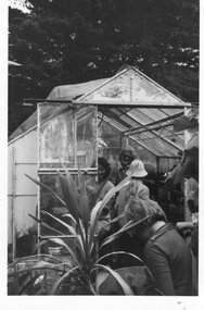 Photograph of a group of people in a greenhouse, 21/01/1980