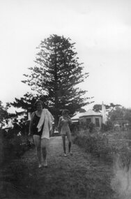 Photograph - Photograph of two people walking to the dam, Unknown