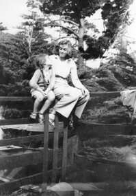 Photograph - Photograph of two people sitting on a fence