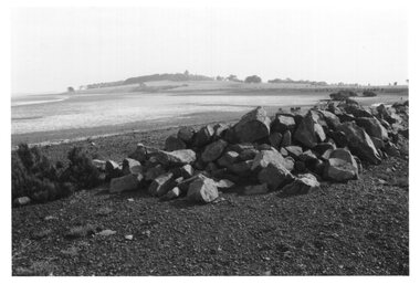 Photograph - Photograph of rocks and boulders by the shoreline