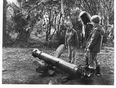 Photograph - Photograph of children standing around the cannon barrel