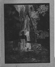 Negative - Negative boy standing in front of tree