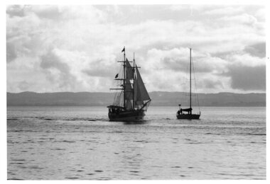 Photograph of ship and boat