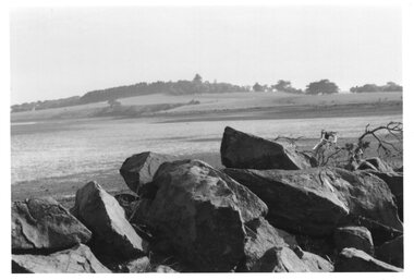 Photograph of large rocks and shoreline