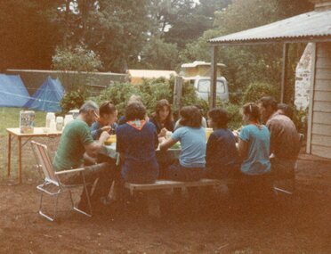Photograph of people eating