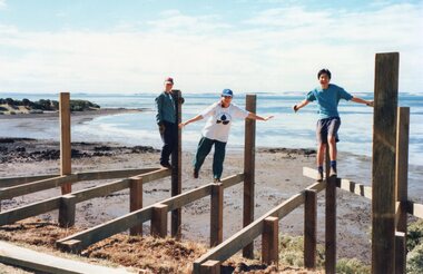 Photograph of people balancing on unfinished jetty