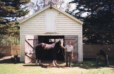 Photograph of man and a horse