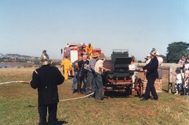 Photograph of volunteers demonstrating the fire engine