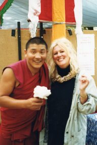 Photograph of Tibetan monk and a woman