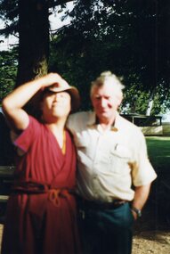 Photograph of a Tibetan monk posing with a man