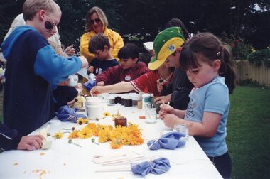 Photograph of children gathered around an activity table