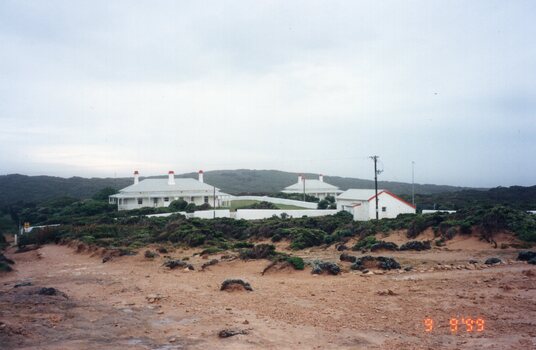 Photograph of a group of houses at Cape Nelson