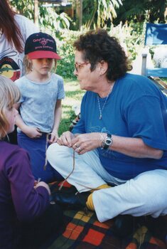 Photograph of a woman and two girls