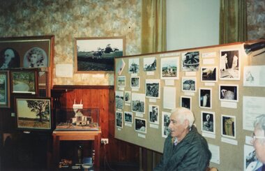 Photograph of people in front of a display