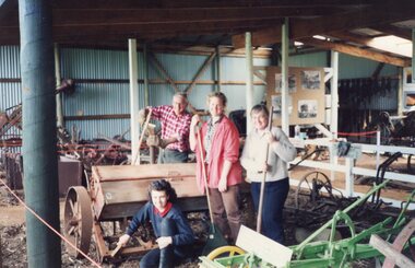 Photograph of four people in Amess Barn