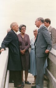 Photograph of group of six people talking