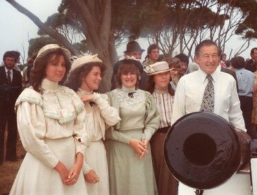 Photograph of group standing around the cannon