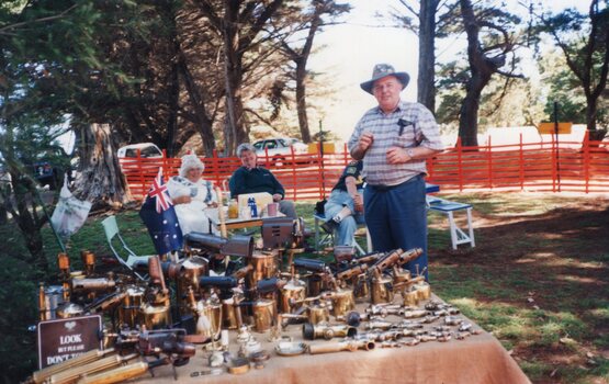 Photograph of brass/copper items on market stall