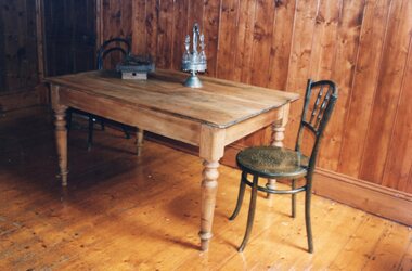 a rectangular pine dining table