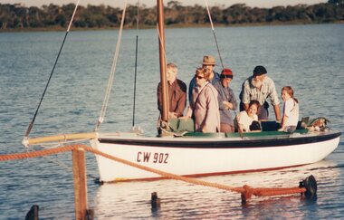 Photograph of people on sailboat