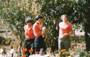 Photograph of women in a garden