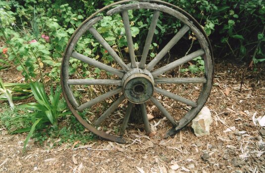 Wagon Wheel resting against a wall
