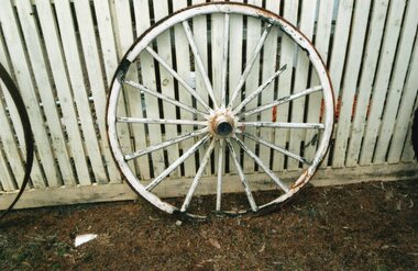 photograph of a white sulky wheel