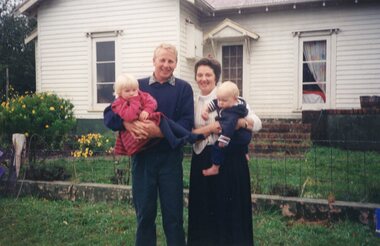 Photograph of two people and two children