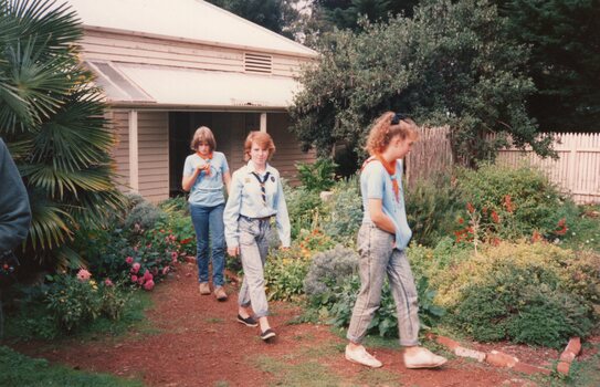 Photograph of three Guides in the garden
