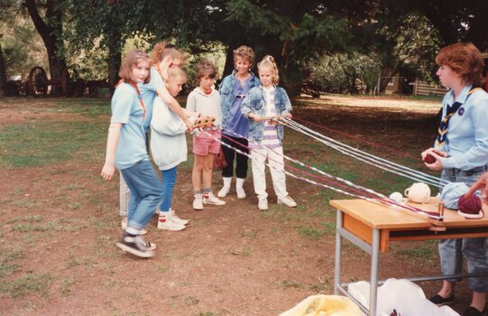 Photograph of children making wool rope