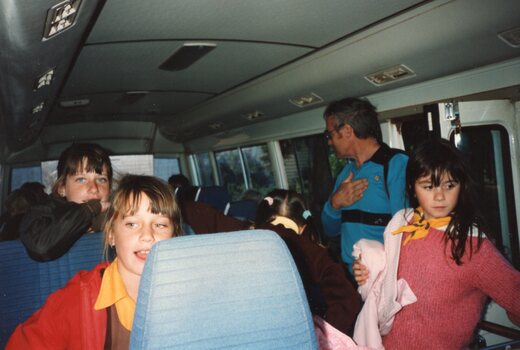 Photograph of people in a minibus