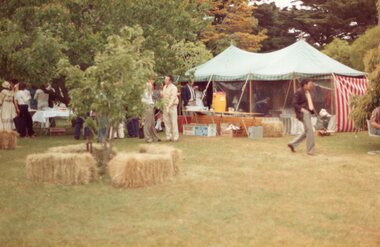 Photograph of market stalls and hay bales
