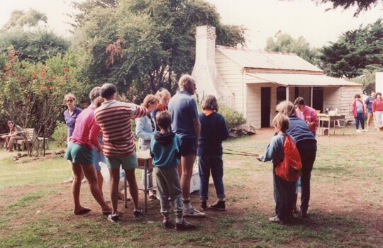 Colour photograph of groups beside Rogers Cottage