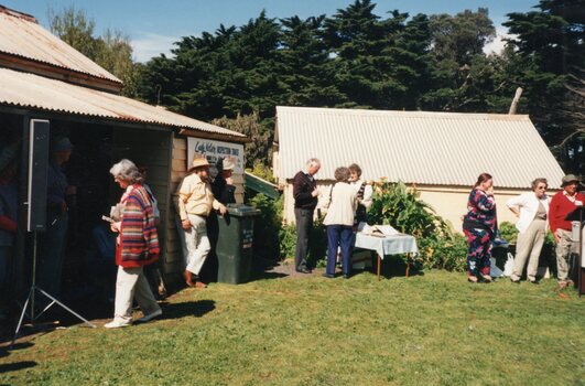 Photograph of group and buildings