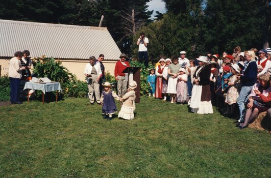 Photograph of two children and group