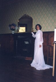 Photograph of a woman in white