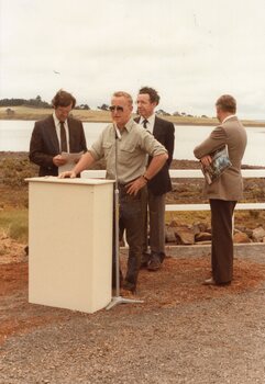 Photograph of man at lectern