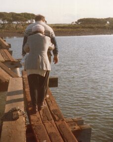 colour photograph of people walking