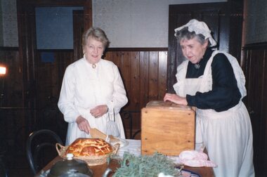Photograph of two women in the kitchen