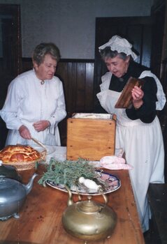 Photograph of two women in the kitchen