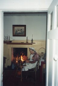 Colour photograph of seated woman