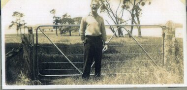 photograph of man and fence
