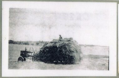 Photograph of hay on tractor