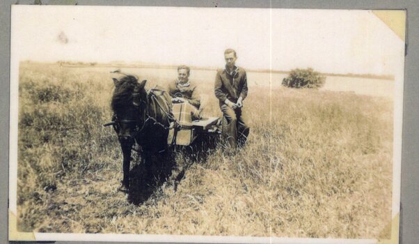 Photograph of pony and two men