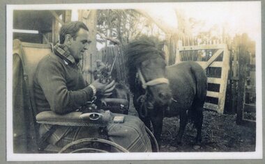 Photograph of man and pony