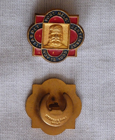 Both sides of a 1939 Liardet Port Melbourne Centenary badge. Front has the engraved image of a man with a full beard. The reverse side has a buttonhole fitting.