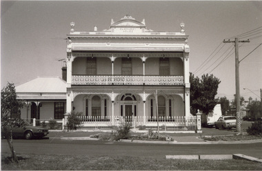 A large two storey double fronted Victorian era residence named 'Guernsey House'.