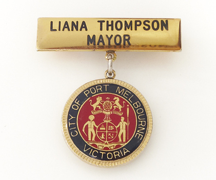 Coloured photo of a City of Port Melbourne Mayoral Badge. Mayors name is inscribed on the front of badge. 