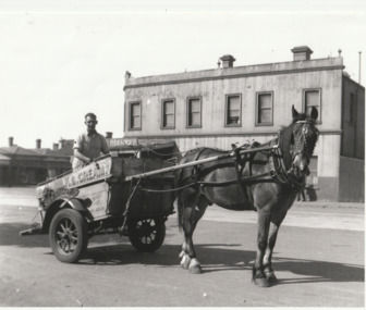 Photograph - William Raeburn STUART on milk float with new horse, Bridge Street, near Ross Street, Port Melbourne, 1940s