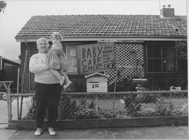 Photograph - Evelyn May Kennedy holding Nicole Wilson, Baby Care Emergencies, The Boulevard, Fishermens Bend, 1990s